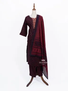 Burgundy Straight Cut Suit Adorned with Floral Prints and Thread work along with Dupatta