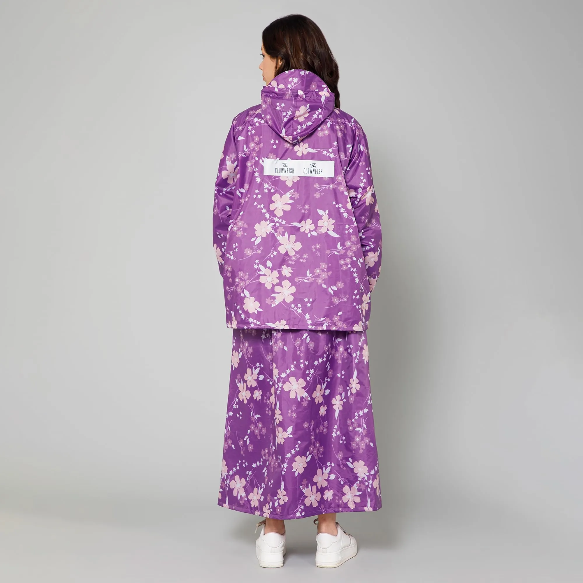 THE CLOWNFISH Polyester Waterproof Rain Coat For Women Skirt and Top Raincoat With Adjustable Hood and Front Pockets Rain Glam Series (Purple Floral, XX-Large)